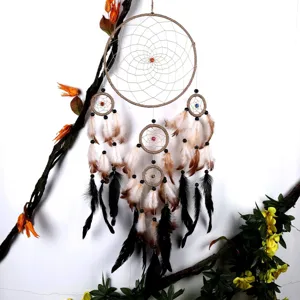 Handcrafted multi-ring dream catcher with feathers and beads for wall home decor details.