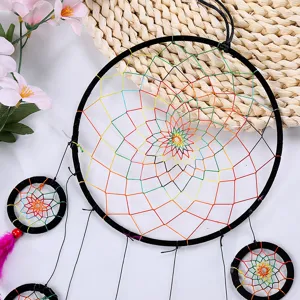 Detailed shot of the colorful woven dream catcher showing intricate web pattern and rings.