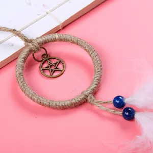 Handmade mini dream catcher car hanging ornament with feathers, twine ring and star charm.
