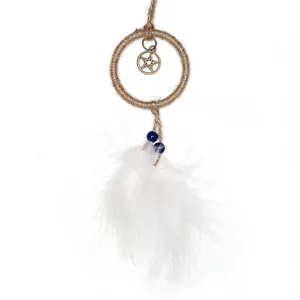 Mini handmade dream catcher detail showing white feathers, blue beads, and a metal pentagram.