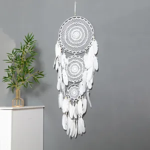 Large handmade bohemian dreamcatcher with white feathers, perfect for indoor wall decor.