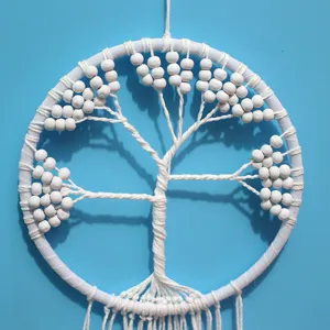 Macro detail of white macrame tree of life dream catcher handmade wall hanging decor.