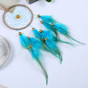 Detailed view of turquoise handmade feather dreamcatcher wall hanging ornament decor