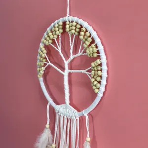 Macro view of white Tree of Life dreamcatcher showing intricate woven rope and beads detail