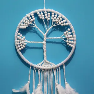 Elegant handmade white tree of life dreamcatcher featuring feathers and beads for wall decor