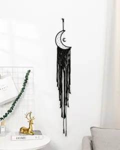 Handmade black moon woven wall hanging detail, boho macrame dream catcher decor.