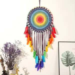 Large rainbow dream catcher wall hanging with colorful feathers, handmade bedroom decor.
