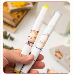 Close-up of cute cartoon cat stickers applied on white markers for stationery decoration