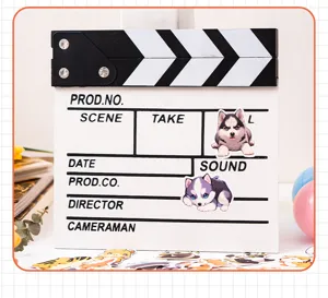 Detail view of cute cartoon husky stickers on a clapperboard for journals