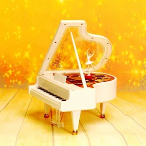 Nahaufnahme einer weißen Klavier-Spieluhr mit einer rotierenden Ballerina-Figur innen.