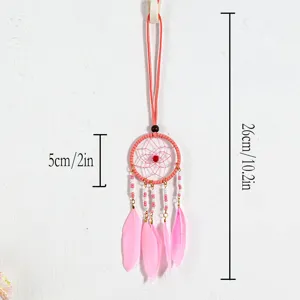 Detailed view of handmade pink dreamcatcher pendant with size specifications