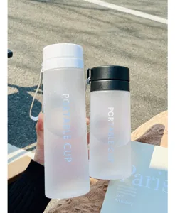 Detailed close-up view of frosted plastic portable water cups with lids, couple style cups.