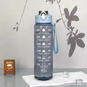 Transparent plastic sports water bottle with time marker, straw, and portable handle for outdoor gym.