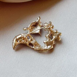 Gold tone alloy fox brooch back detail showing secure pin closure for women fashion accessory.