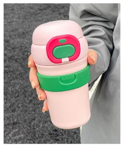 Portable insulated coffee travel mug with cute pink and green design for students and daily use.