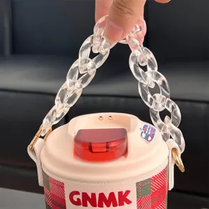 Close-up view of a pink coffee thermal cup featuring a chunky transparent acrylic chain handle