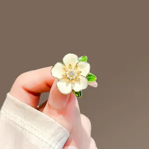 Detail shot of high-end Japanese style gardenia flower brooch with pearls and crystals