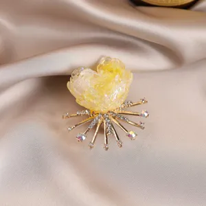Elegant yellow floral brooch with sparkling rhinestones and gold-tone alloy for women's outfits.
