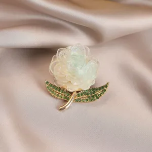 Exquisite multi-color peony flower brooch with sparkling green crystal leaves and metal stem.