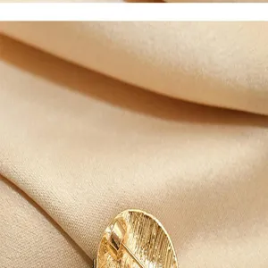 Gold textured metal brooch pin, elegant anti-glare collar accessory for women's suits hats.
