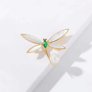 Exquisite pearl dragonfly brooch detail, elegant gold metal crystal pin for women sweaters.