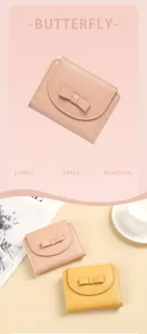 Close-up of elegant women's short wallet with bow knot and PU leather texture