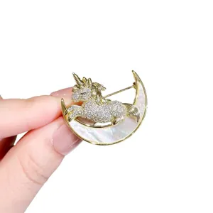Exquisite unicorn crescent moon brooch, elegant rhinestone crystal suit pin accessory.