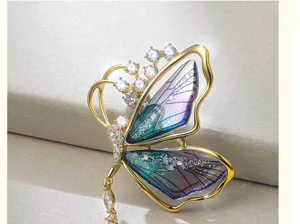 Elegant translucent gradient butterfly brooch with cubic zirconia crystals and gold tassel.