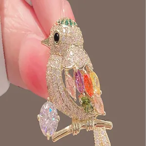 Sparkling crystal bird brooch detail, colorful zircon gems, chic lapel pin for women.