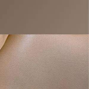 Fine fabric texture close-up detail showcasing smooth beige material quality for apparel.