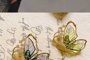 Close-up detail of forest style translucent butterfly brooch with zirconia and tassel.