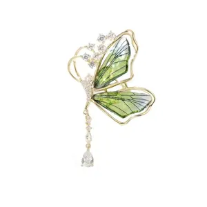 Elegant green butterfly brooch with translucent wings, sparkling zircon and tassel pendant.