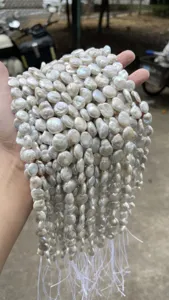 Close-up view of high quality natural white baroque coin pearls for DIY jewelry making.