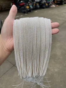 Close-up of high-luster natural white freshwater pearl strands for professional DIY jewelry