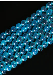 Detailed macro shot of 6mm blue sugar heart agate round beads for DIY jewelry
