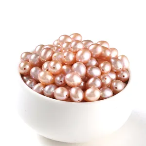 High luster natural freshwater pink purple rice-shaped loose pearl beads in a white bowl