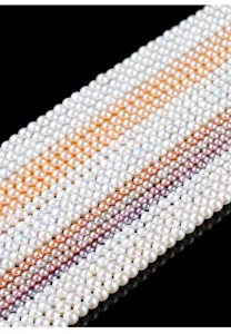 Detailed view of natural freshwater pearl strands in white, pink, and lavender hues