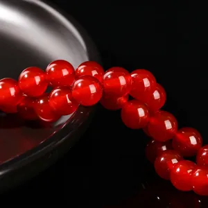 High-quality natural red agate round beads for DIY jewelry making and craft projects.