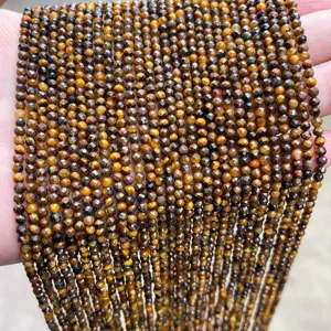 Macro view of faceted natural yellow tiger eye loose beads for jewelry making