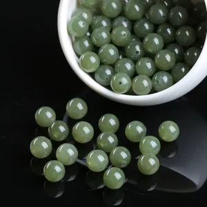 Macro view of natural green nephrite jade round beads for DIY jewelry making material
