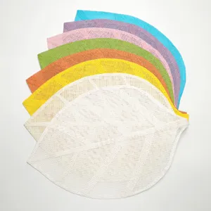 Colorful leaf shaped paper placemats detail view, perfect for dining table decor and DIY crafts.