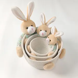 Set of three nesting woven rabbit storage baskets for desktop organization