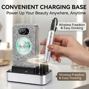 Close-up of a rhinestone nail drill machine docking into its sleek charging base