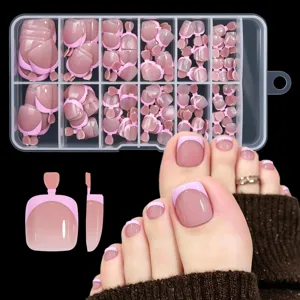 Detail showing nude pink French tip press-on toenails set in a 12-grid storage box