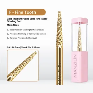 Close-up detail of gold titanium plated extra fine taper nail grinding burr