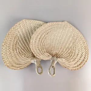 Detailed close-up view showing the natural texture of hand-woven palm leaf fans