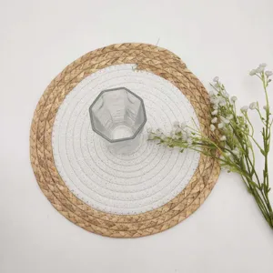 Close-up of circular woven grass and cotton rope placemat with heat resistance