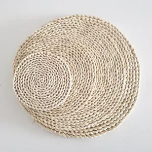 Handcrafted natural corn husk placemat and heat resistant straw mat for dining table.