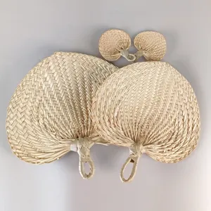 Hand-woven natural palm leaf fans in two sizes for summer cooling and decor