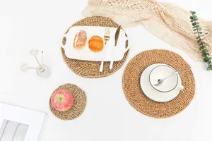 Handmade natural straw woven placemat detail view, heat resistant table mat and coaster set.